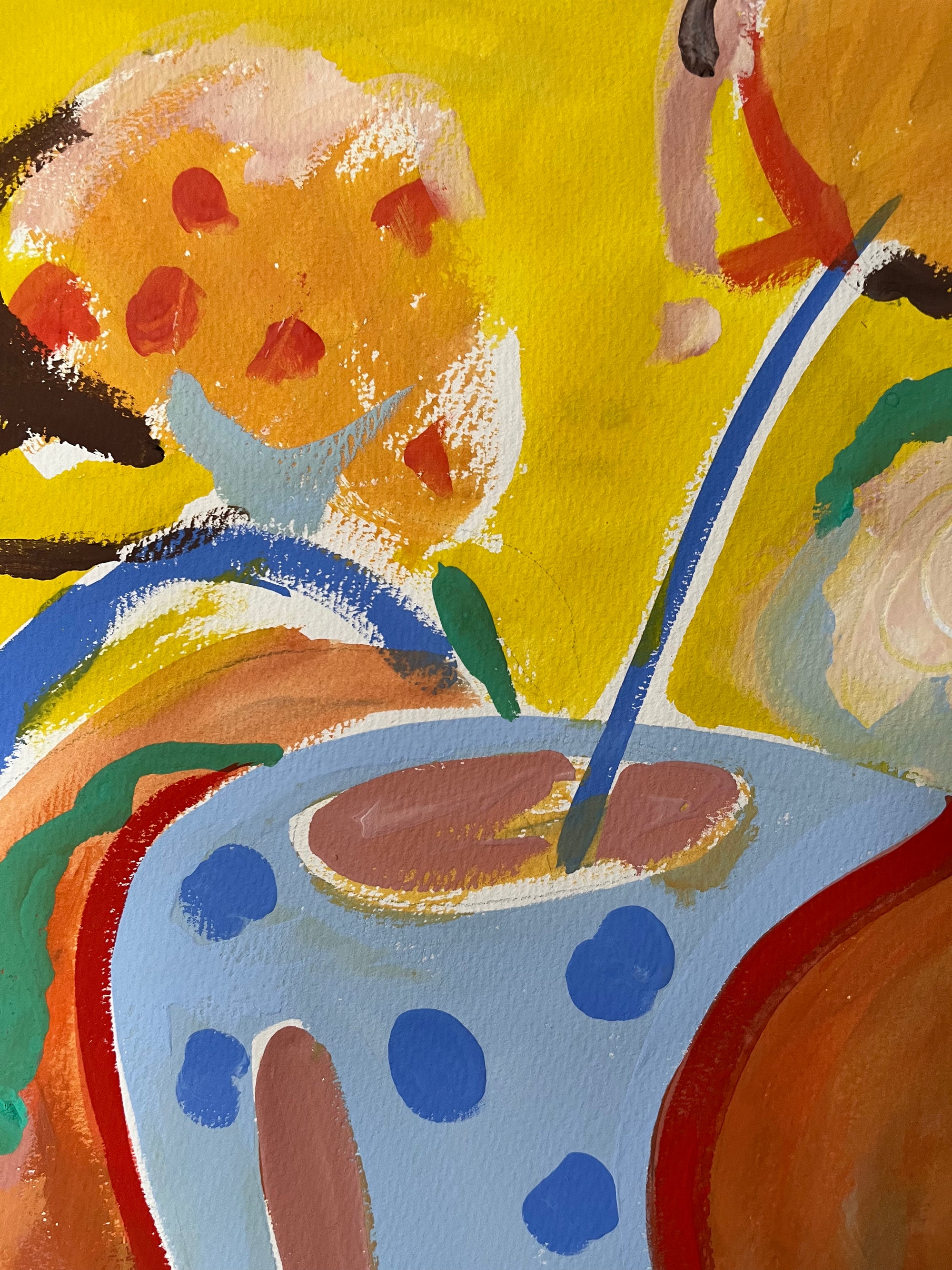 Abstract artwork with a polka dot cup, blue straw, and colorful background