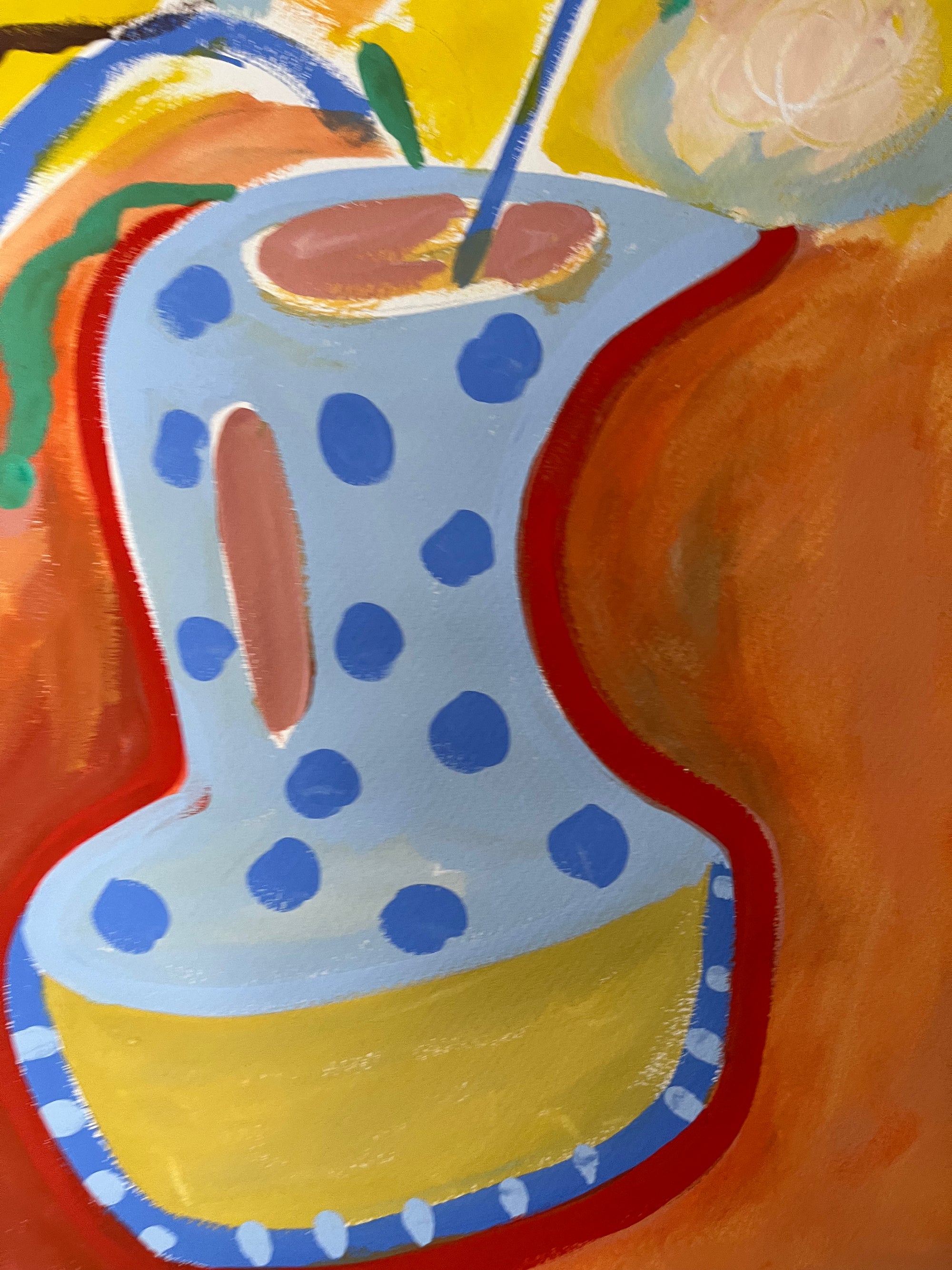 Colorful abstract painting of a polka dot vase with a slice of lemon on an orange background
